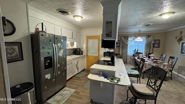 211 Boyd St, Ridgeland, MS 39157 - kitchen with white appliances, crown molding, white cabinetry, a textured ceiling, and wood finished floors