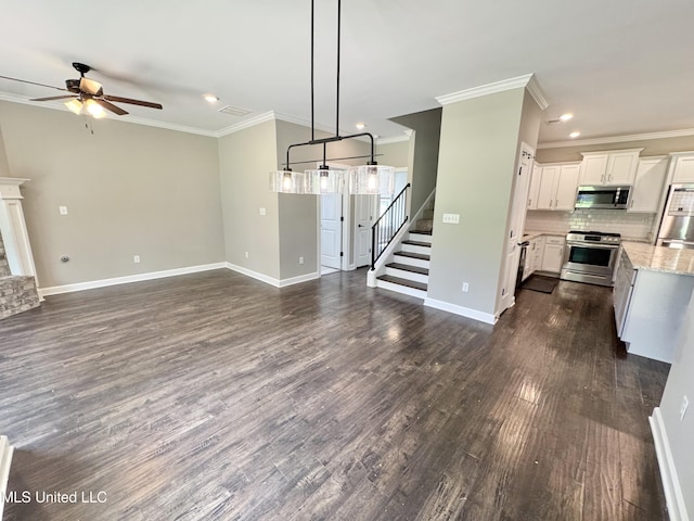 3464 Delaney Dr, Nesbit, MS 38651 - unfurnished living room with a ceiling fan, crown molding, stairs, recessed lighting, and baseboards