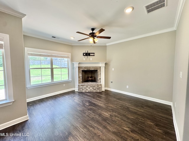 3464 Delaney Dr, Nesbit, MS 38651 - unfurnished living room featuring ceiling fan, ornamental molding, dark wood-style floors, baseboards, and a brick fireplace