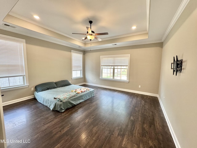 3464 Delaney Dr, Nesbit, MS 38651 - bedroom featuring a raised ceiling, dark wood finished floors, crown molding, baseboards, and ceiling fan