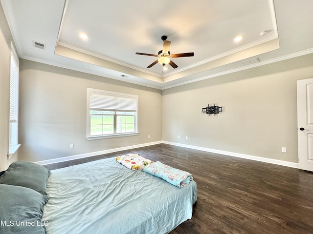 3464 Delaney Dr, Nesbit, MS 38651 - bedroom featuring a raised ceiling, dark wood finished floors, ornamental molding, and baseboards