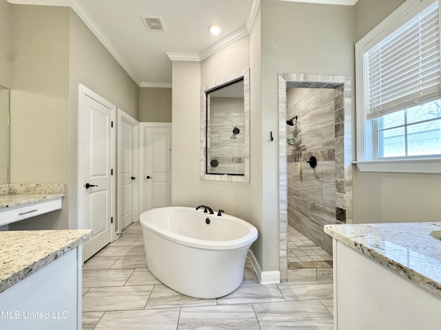 3464 Delaney Dr, Nesbit, MS 38651 - bathroom featuring ornamental molding, a walk in shower, a freestanding tub, vanity, and baseboards