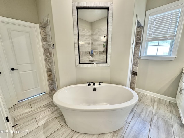 3464 Delaney Dr, Nesbit, MS 38651 - full bathroom with a soaking tub and a tile shower