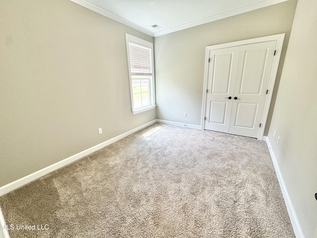 3464 Delaney Dr, Nesbit, MS 38651 - unfurnished bedroom featuring crown molding, carpet flooring, baseboards, and a closet