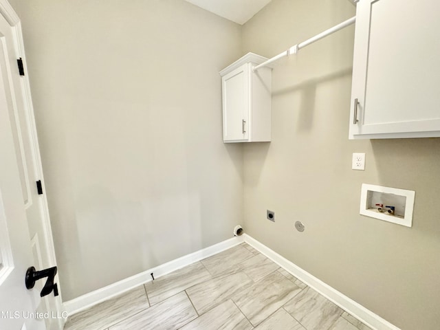 3464 Delaney Dr, Nesbit, MS 38651 - washroom with hookup for a washing machine, hookup for an electric dryer, cabinet space, baseboards, and light marble finish floors