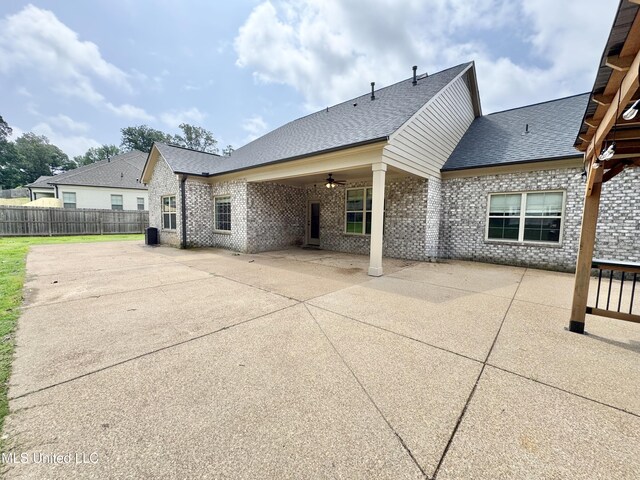 3464 Delaney Dr, Nesbit, MS 38651 - back of house featuring a patio area, roof with shingles, brick siding, and ceiling fan