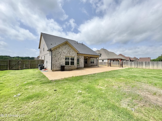 3464 Delaney Dr, Nesbit, MS 38651 - back of property with a patio area, brick siding, and central AC