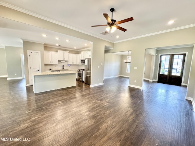3464 Delaney Dr, Nesbit, MS 38651 - unfurnished living room with a ceiling fan, a sink, baseboards, crown molding, and dark wood-style floors