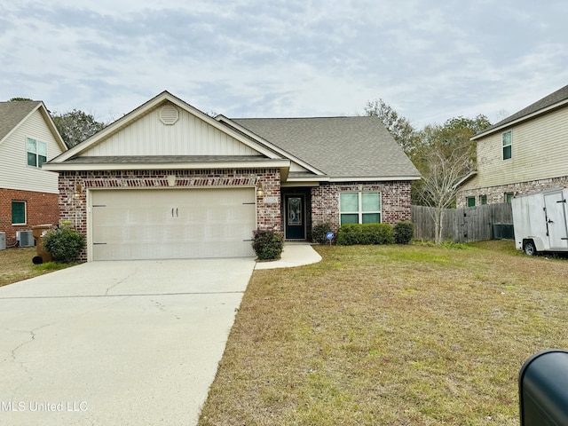 view of front of property with a garage, brick siding, fence, driveway, and a front lawn