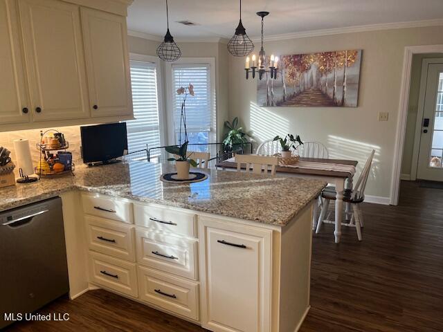 kitchen with light stone counters, stainless steel dishwasher, dark hardwood / wood-style floors, a chandelier, and pendant lighting