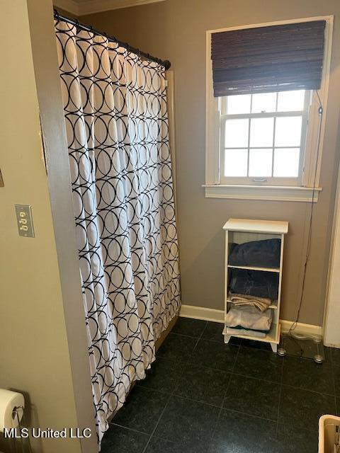 715 Sumner Ave, Greenwood, MS 38930 - full bathroom featuring tile patterned floors and curtained shower