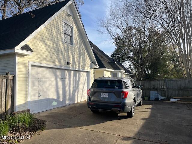 view of side of property with a garage