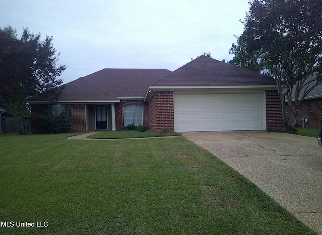 ranch-style house featuring a front lawn and a garage