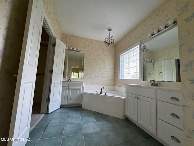 104 Warrior Ln, Clinton, MS 39056 - full bathroom featuring wallpapered walls, two vanities, a bath, a chandelier, and tile patterned flooring
