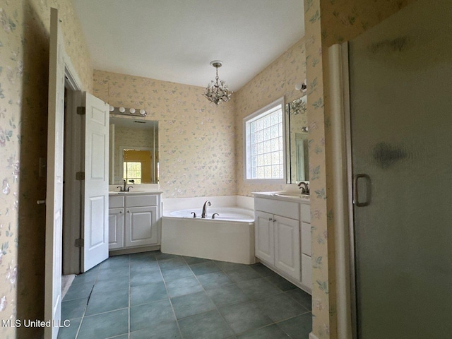 104 Warrior Ln, Clinton, MS 39056 - bathroom featuring wallpapered walls, two vanities, a chandelier, a stall shower, and a bath