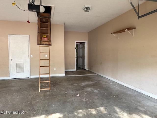 104 Warrior Ln, Clinton, MS 39056 - garage with a garage door opener and baseboards