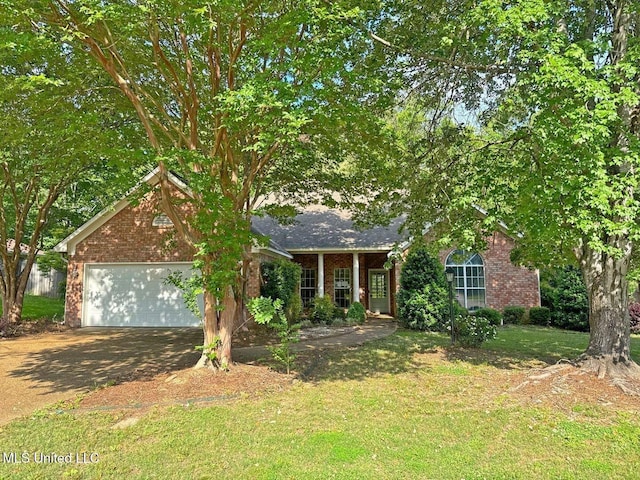 104 Warrior Ln, Clinton, MS 39056 - view of front of property with brick siding, an attached garage, a front yard, and concrete driveway