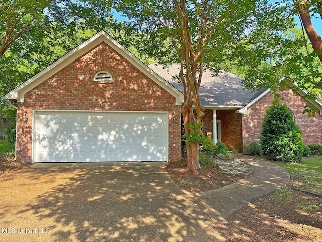 104 Warrior Ln, Clinton, MS 39056 - single story home featuring brick siding, concrete driveway, a garage, and a shingled roof