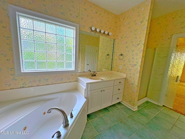 104 Warrior Ln, Clinton, MS 39056 - full bath featuring healthy amount of natural light, wallpapered walls, a tub with jets, vanity, and tile patterned floors