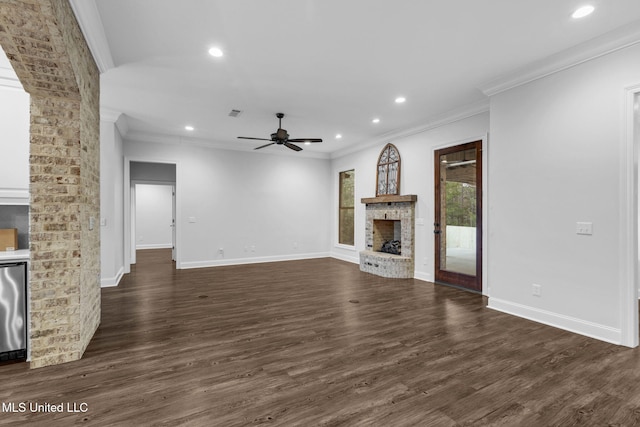 unfurnished living room with recessed lighting, a fireplace, dark wood-type flooring, and ornamental molding