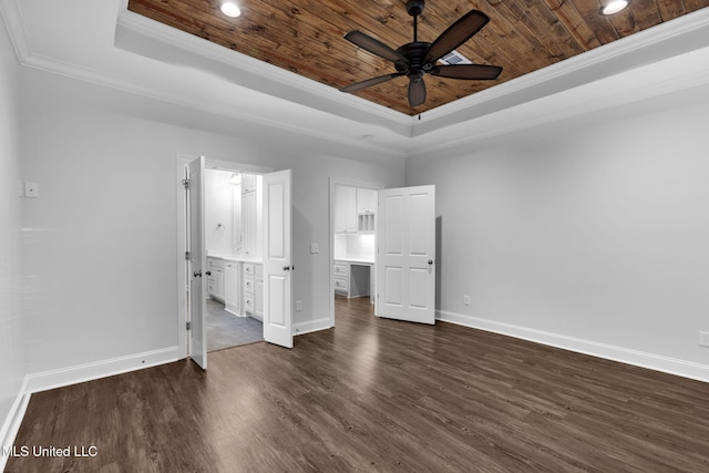 unfurnished bedroom with a tray ceiling, crown molding, and wood ceiling