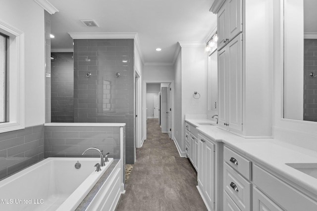 full bath featuring visible vents, crown molding, double vanity, a bath, and a sink