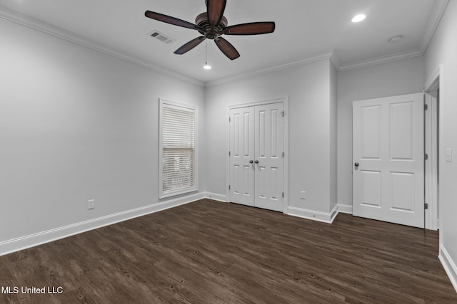 unfurnished bedroom with crown molding, visible vents, and dark wood-style flooring