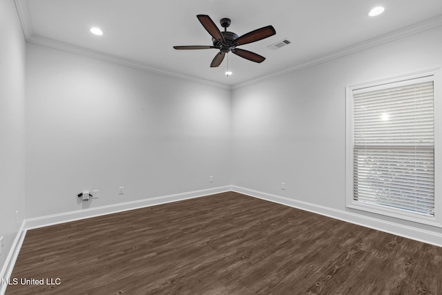 spare room with visible vents, crown molding, baseboards, and dark wood-style flooring