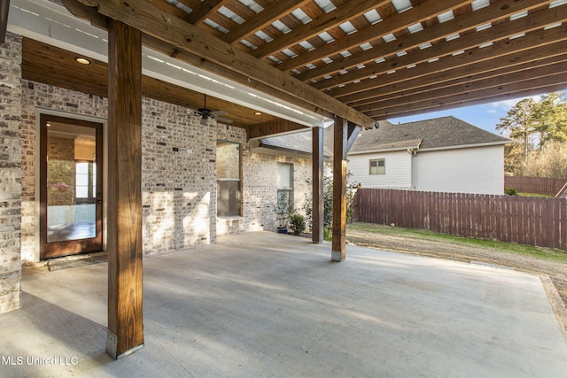 view of patio featuring fence and ceiling fan