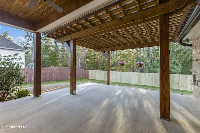 view of patio featuring a ceiling fan and fence