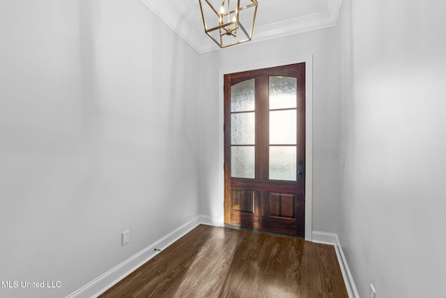 foyer with baseboards, dark wood-type flooring, and ornamental molding