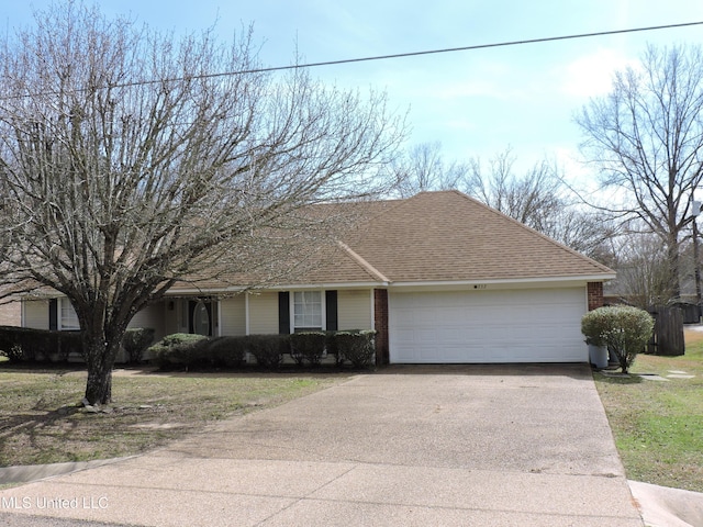 ranch-style house with a garage, driveway, a shingled roof, and brick siding