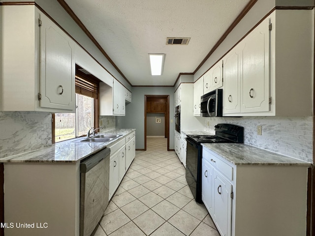 kitchen featuring visible vents, ornamental molding, a sink, stainless steel appliances, and backsplash