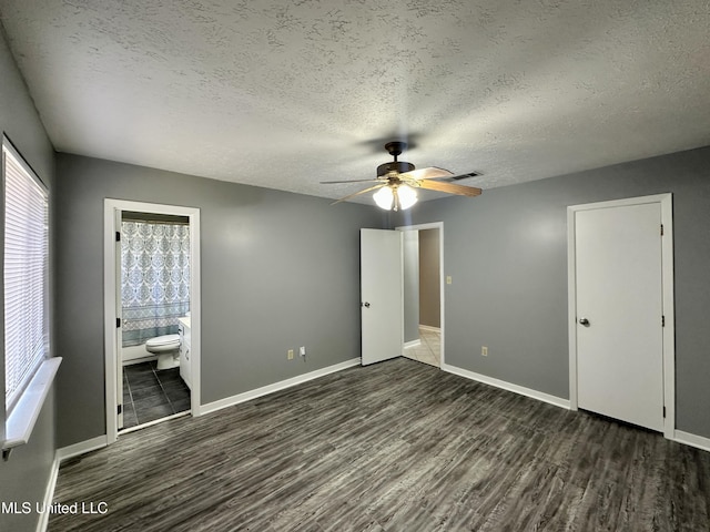 unfurnished bedroom with visible vents, baseboards, and wood finished floors