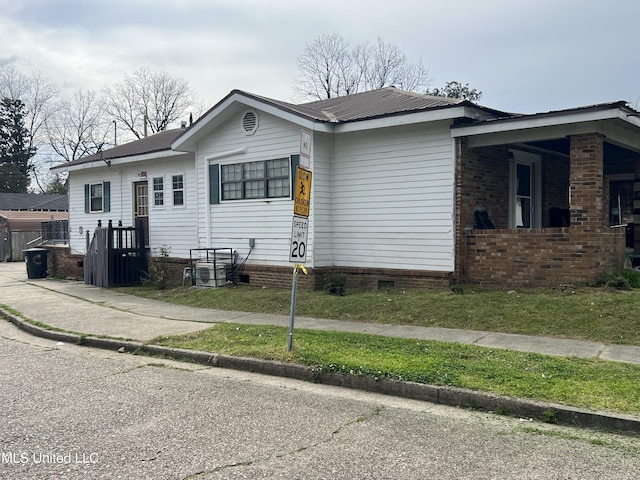 720 Mattingly St, Vicksburg, MS 39180 - view of property exterior featuring crawl space and metal roof