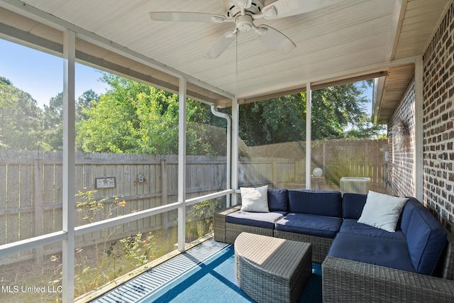 sunroom featuring plenty of natural light, ceiling fan, and an outdoor hangout area