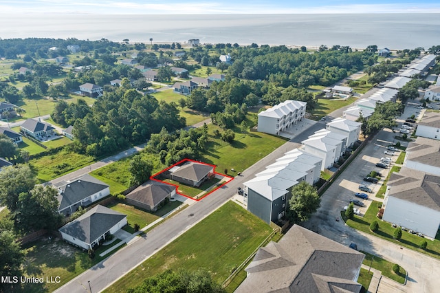 drone / aerial view featuring a water view and a residential view