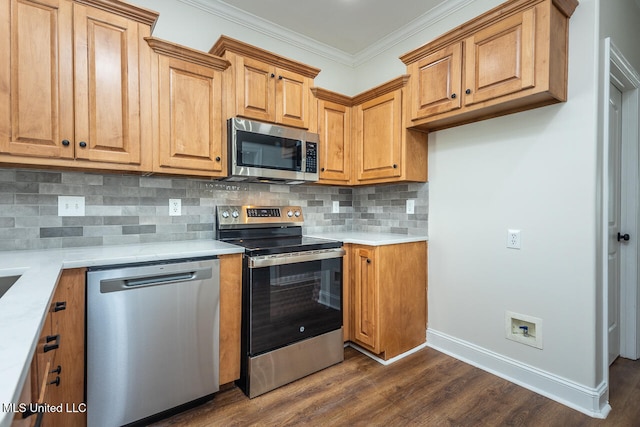 kitchen with backsplash, crown molding, dark hardwood / wood-style floors, and appliances with stainless steel finishes