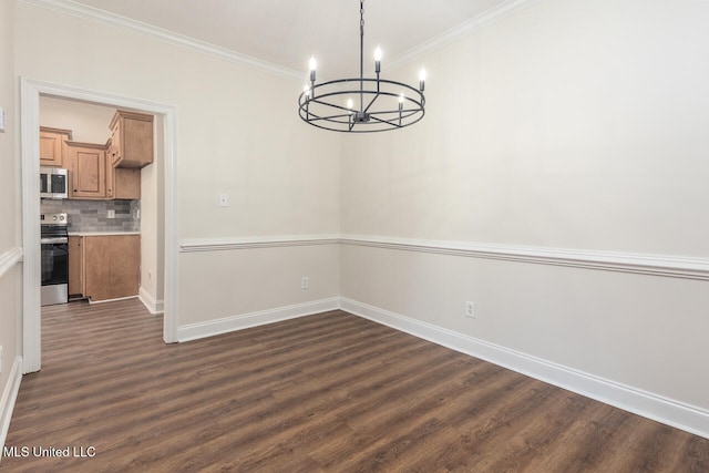 unfurnished dining area with dark hardwood / wood-style flooring, ornamental molding, and a chandelier