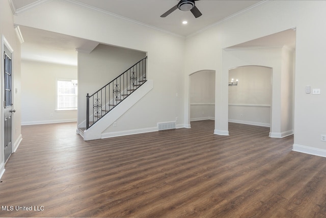 unfurnished living room with dark hardwood / wood-style flooring, ceiling fan, and crown molding