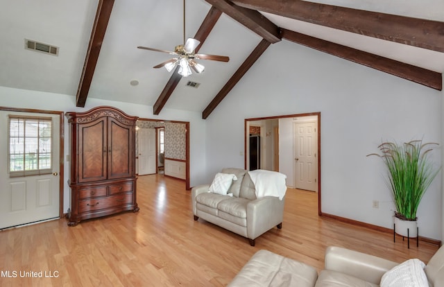 living room with beam ceiling, high vaulted ceiling, light wood-type flooring, and ceiling fan