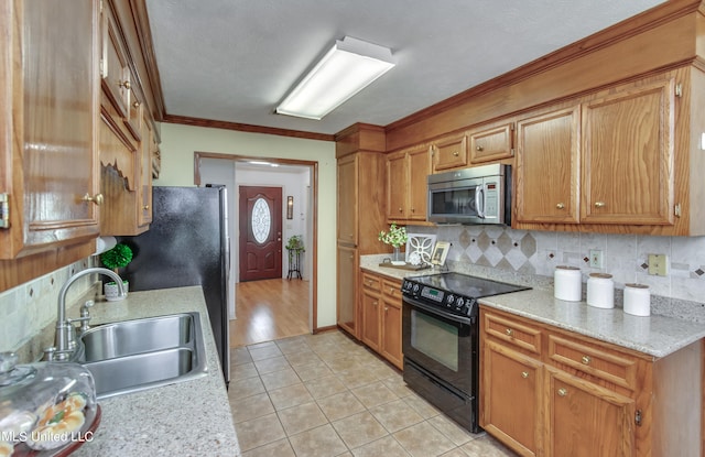 kitchen with sink, light tile patterned floors, ornamental molding, black range with electric cooktop, and backsplash