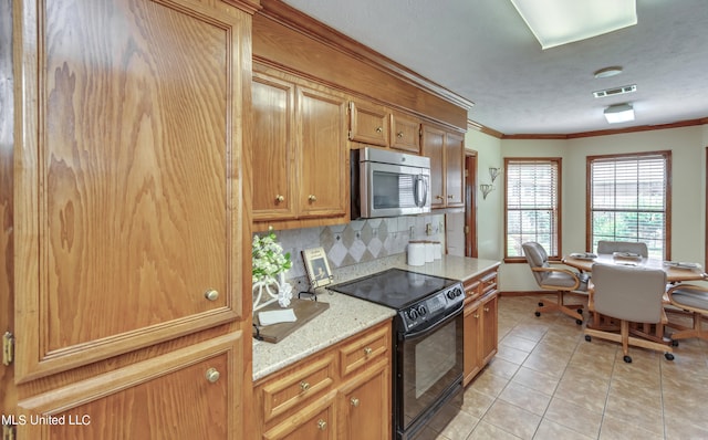 kitchen featuring black electric range oven, ornamental molding, light stone countertops, light tile patterned flooring, and decorative backsplash