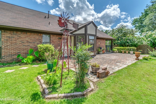 exterior space featuring a yard, a lanai, and a patio area