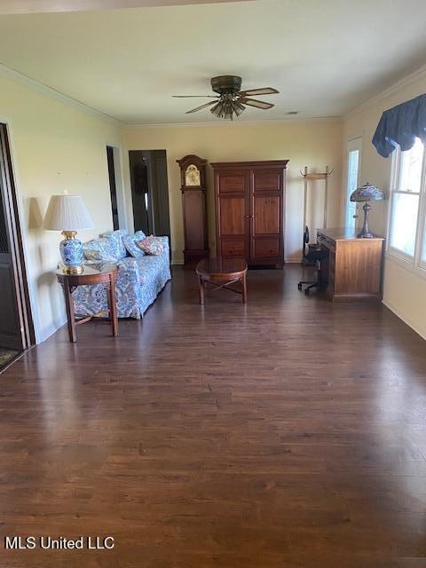 710 Eubanks Rd, Alligator, MS 38720 - living room with dark wood-style floors, ornamental molding, a ceiling fan, and baseboards