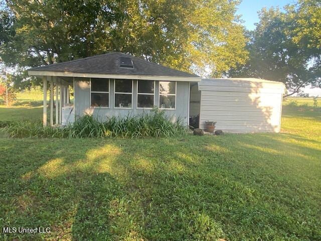 710 Eubanks Rd, Alligator, MS 38720 - rear view of house featuring a yard