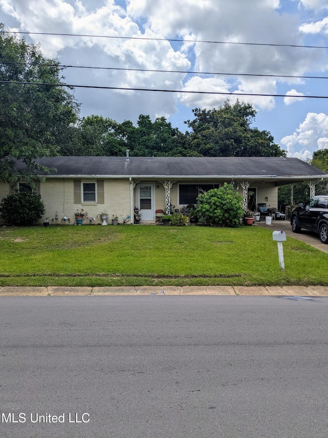 301 N Wilson Blvd, Gulfport, MS 39503 - ranch-style house with an attached carport, a front yard, and driveway