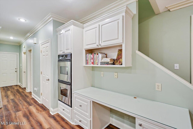 611 Berridge Dr, Ridgeland, MS 39157 - kitchen featuring double oven, white cabinetry, crown molding, dark wood-type flooring, and recessed lighting