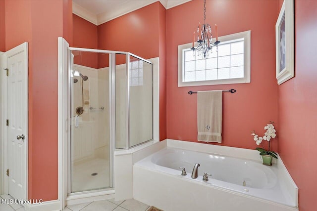 611 Berridge Dr, Ridgeland, MS 39157 - full bath featuring a chandelier, a stall shower, a garden tub, and tile patterned floors