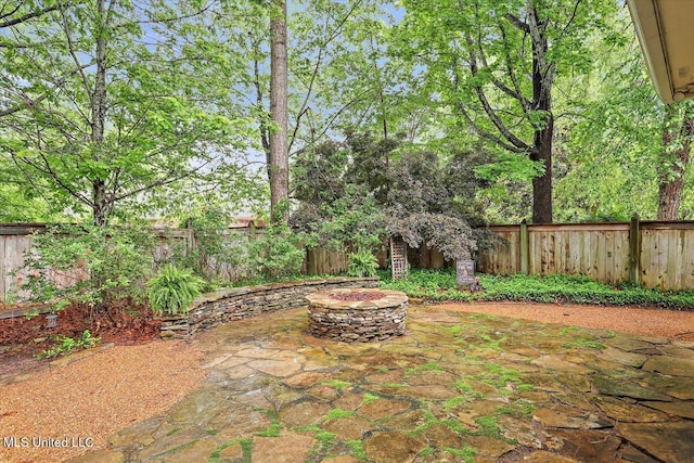 611 Berridge Dr, Ridgeland, MS 39157 - fenced backyard featuring a fire pit and a patio area